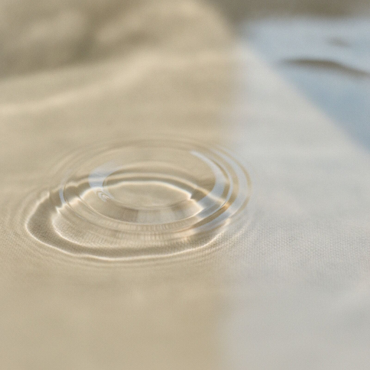 Soft ripples of warm bath water in gentle light
