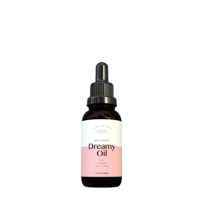 Bottle of Dreamy Oil with a dropper on a white background